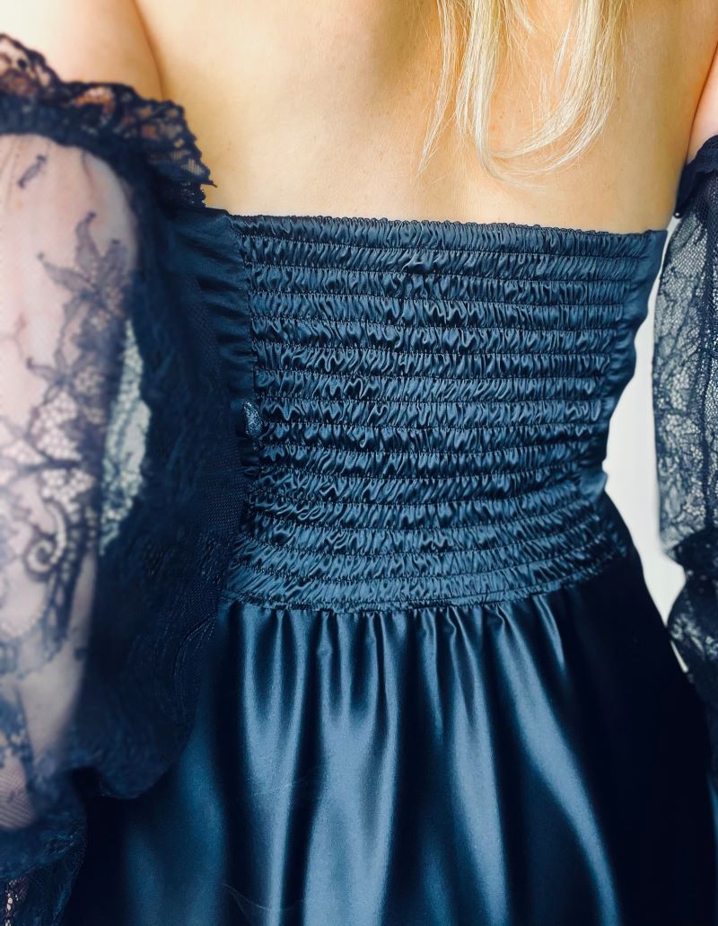 Black chunky dress for the holidays. With lace sleeves.