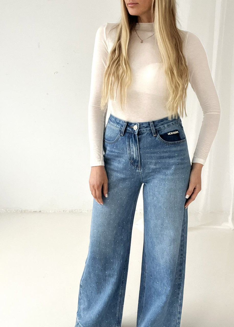 DŽINSI AR SPĪDĪGIEM AKMENTIŅIEM